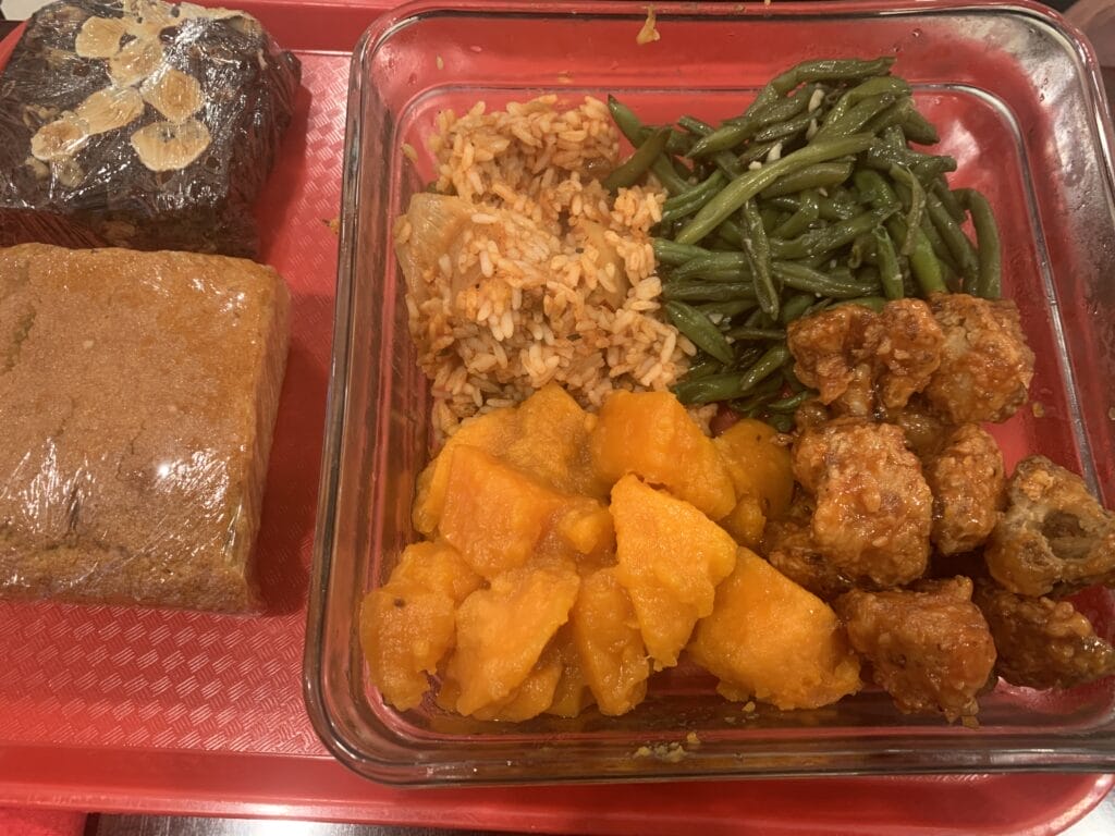 Glass container with 4 options of soul food in New Orleans