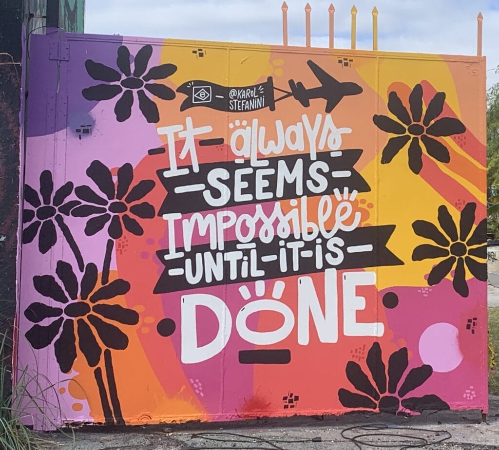 Graffiti art in Wynwood, Florida featuring the quote 'It always seems impossible until it's done.