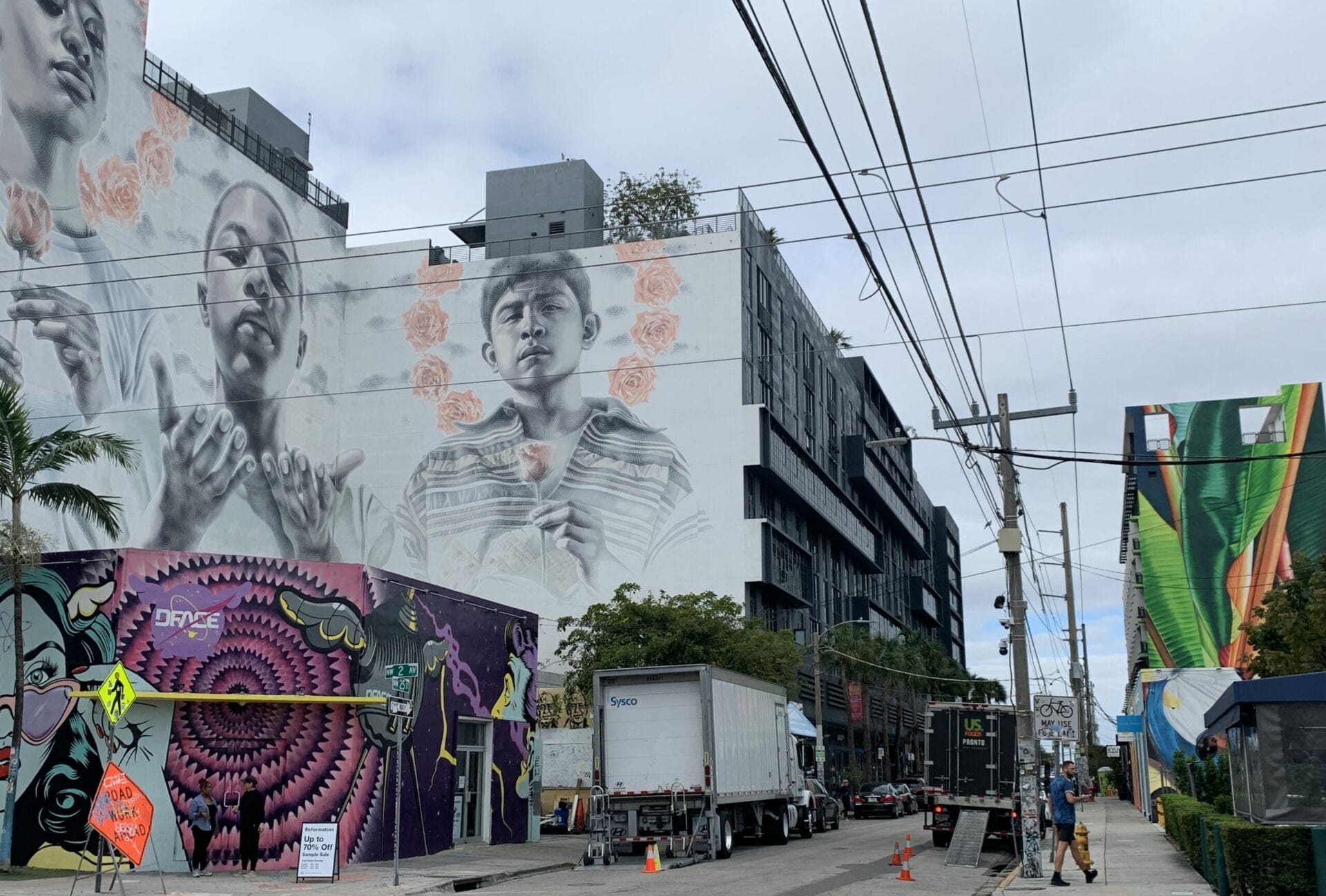 Vibrant street mural in Wynwood, Florida, showcasing colorful artwork on urban walls. Mural is on multiple story buildings.