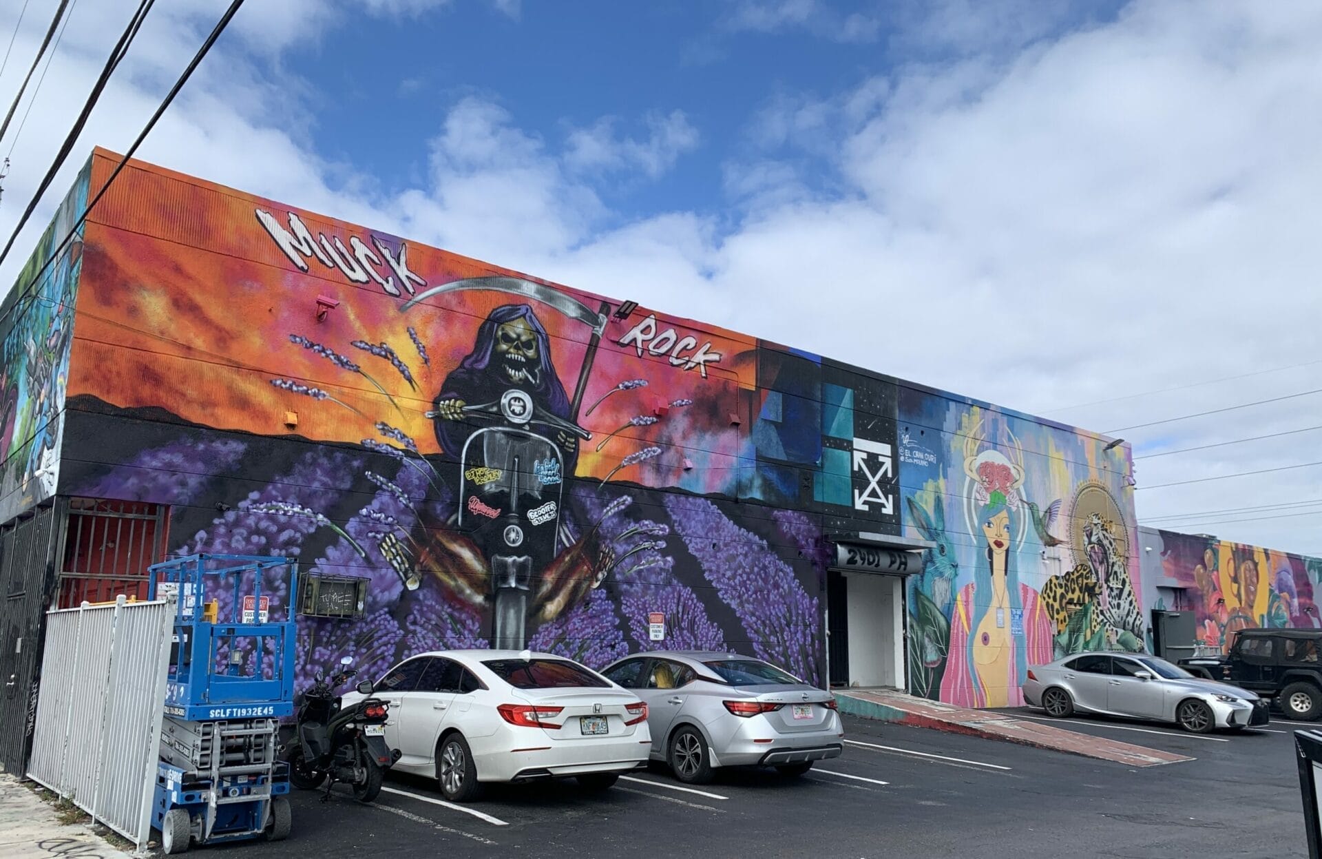 Vibrant street mural in Wynwood, Florida, showcasing colorful artwork on urban walls. So beautifully done!
