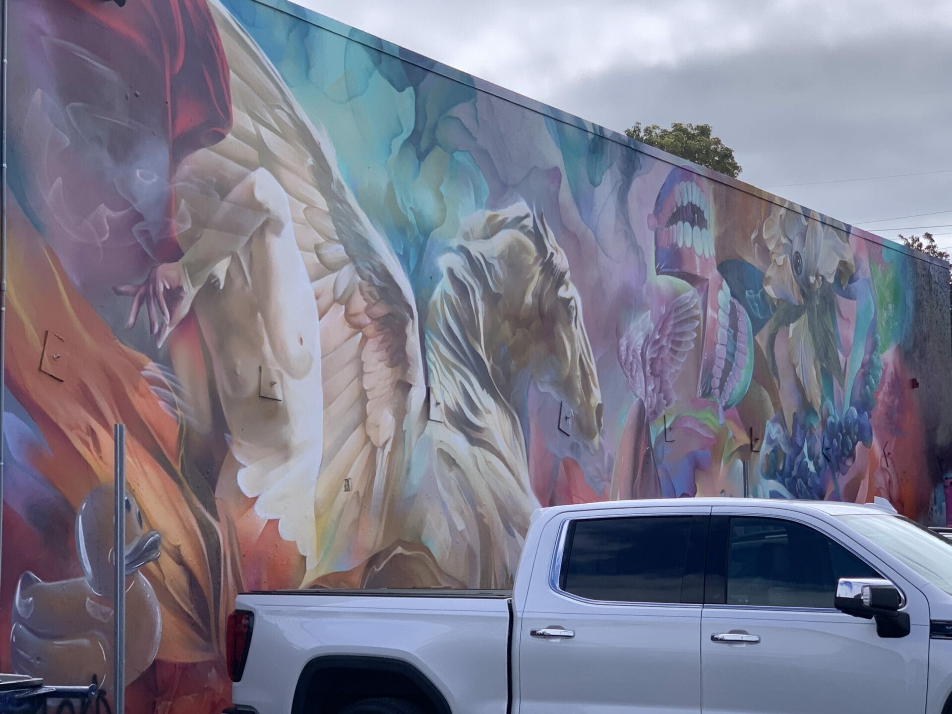 Vibrant street mural in Wynwood, Florida, showcasing colorful artwork on urban walls. The colors here is very dreamy.