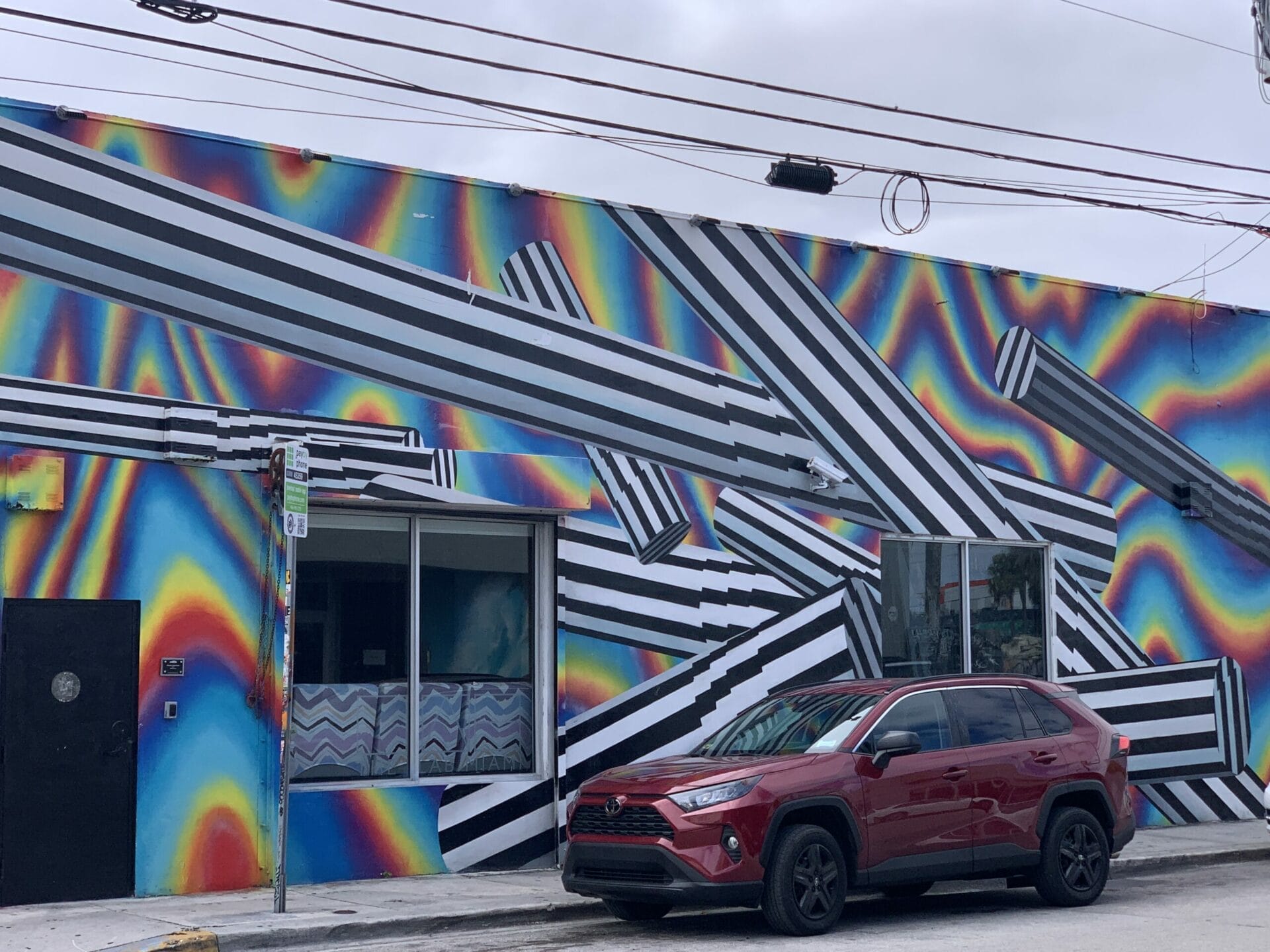 Vibrant street mural in Wynwood, Florida, showcasing colorful artwork on urban walls. psychadelic!
