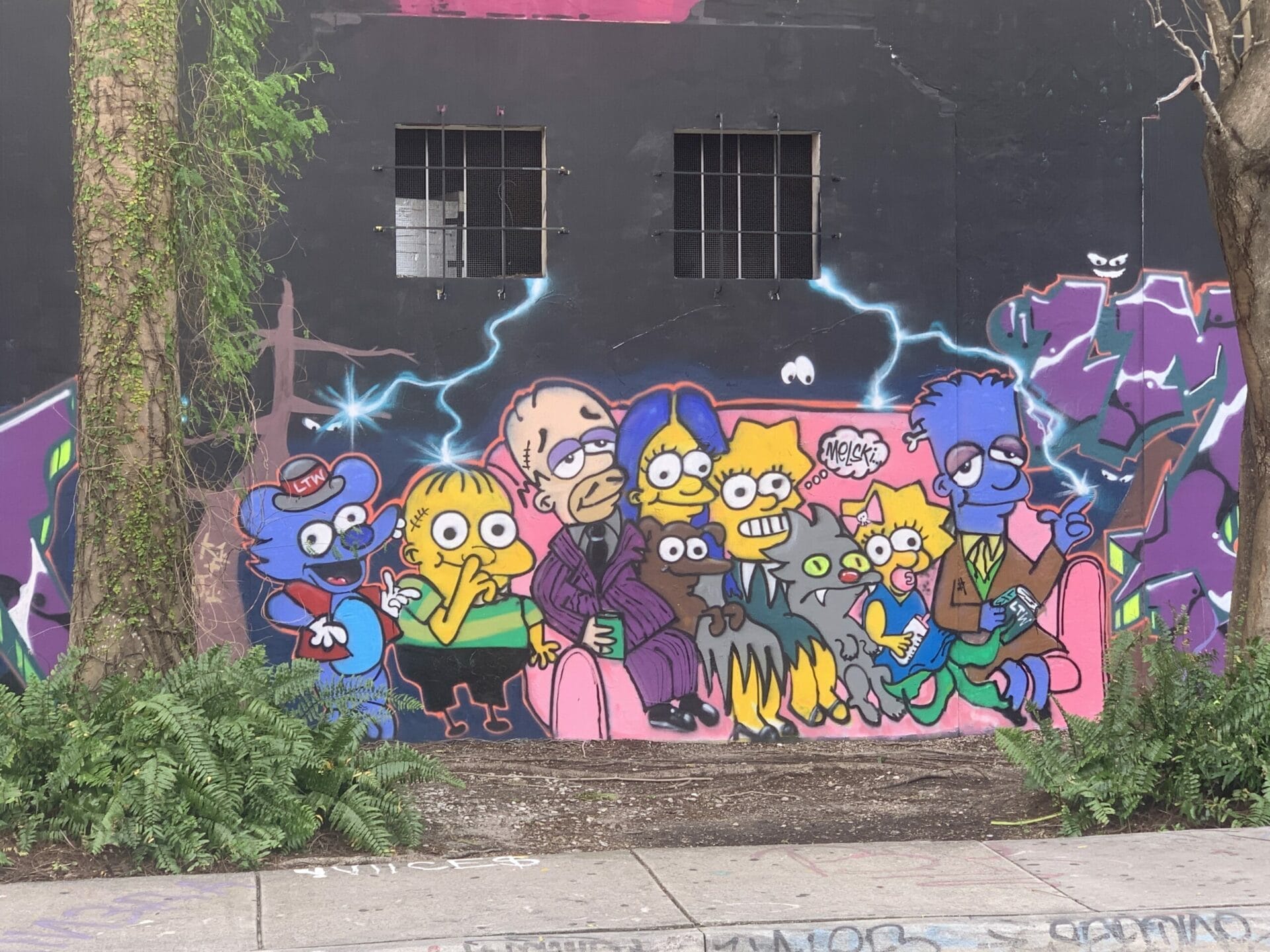 Vibrant street mural in Wynwood, Florida, showcasing colorful artwork on urban walls. Wow, neon colors on the side of the building.