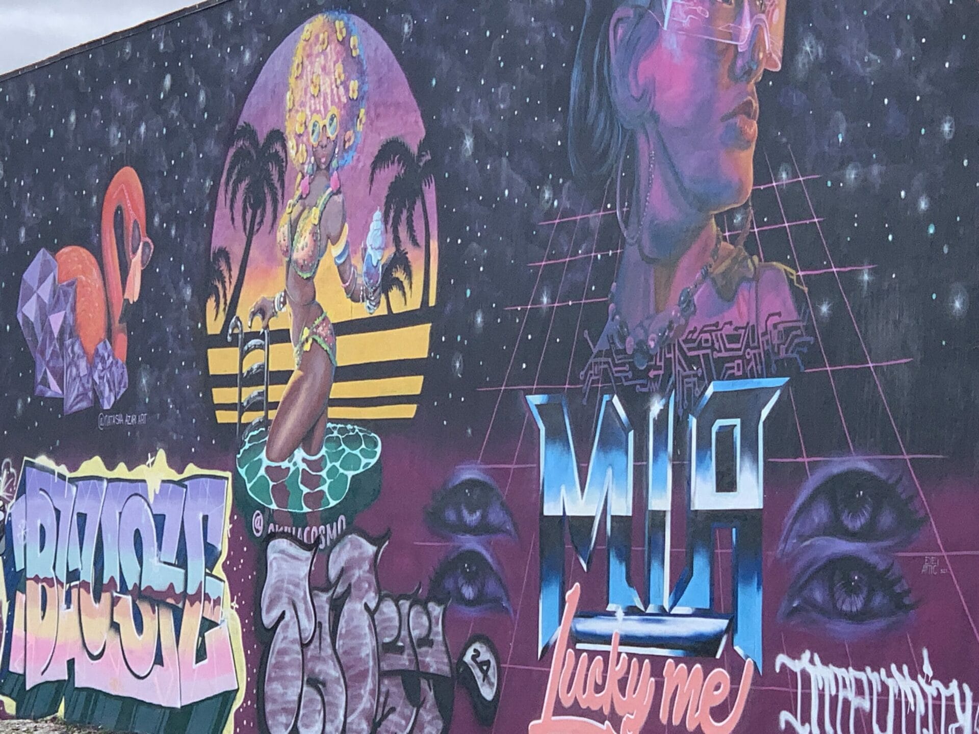 Vibrant street mural in Wynwood, Florida, showcasing colorful artwork on urban walls. colorful mural.