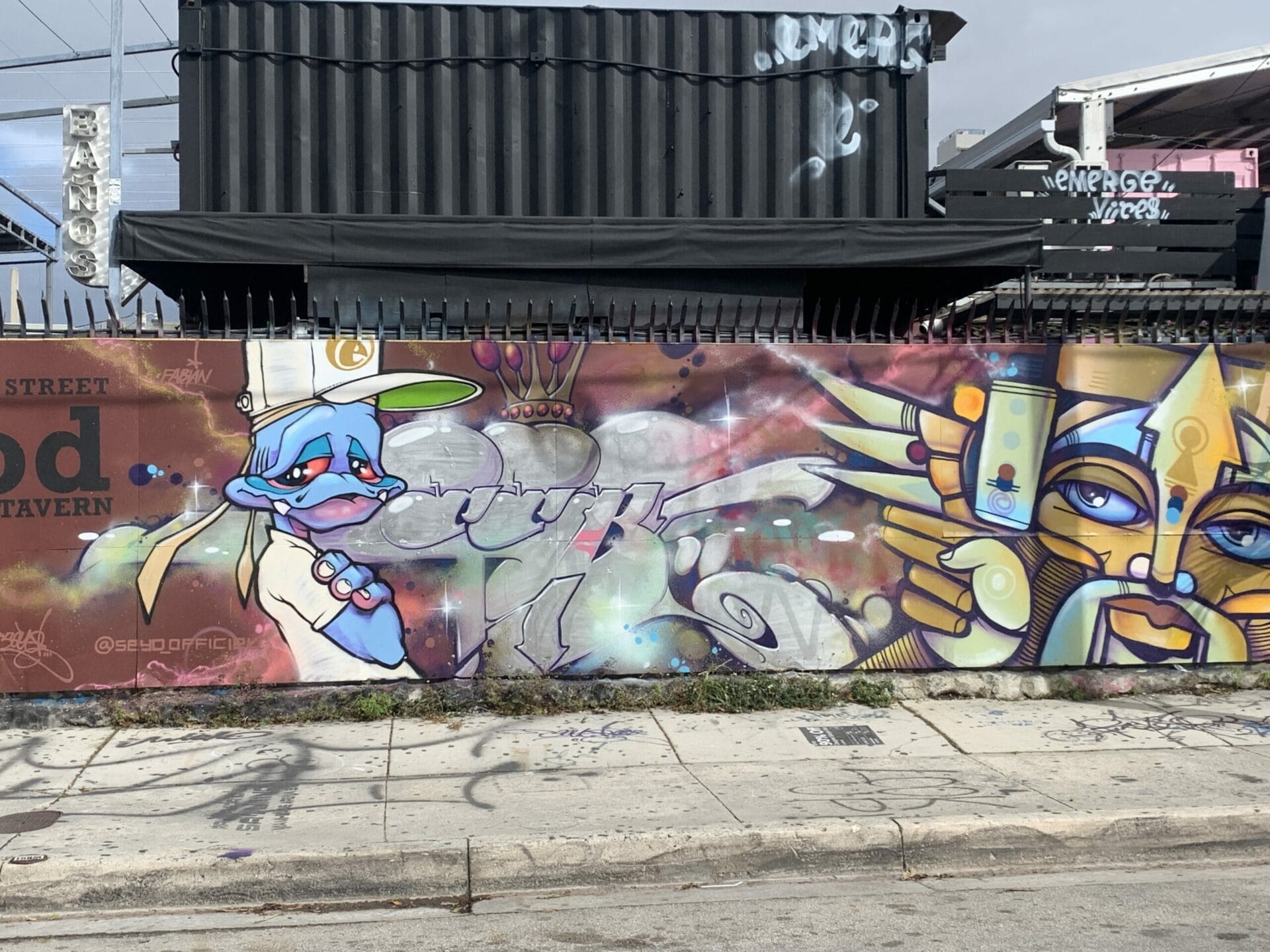Vibrant street mural in Wynwood, Florida, showcasing colorful artwork on urban walls. Cartoon murals.