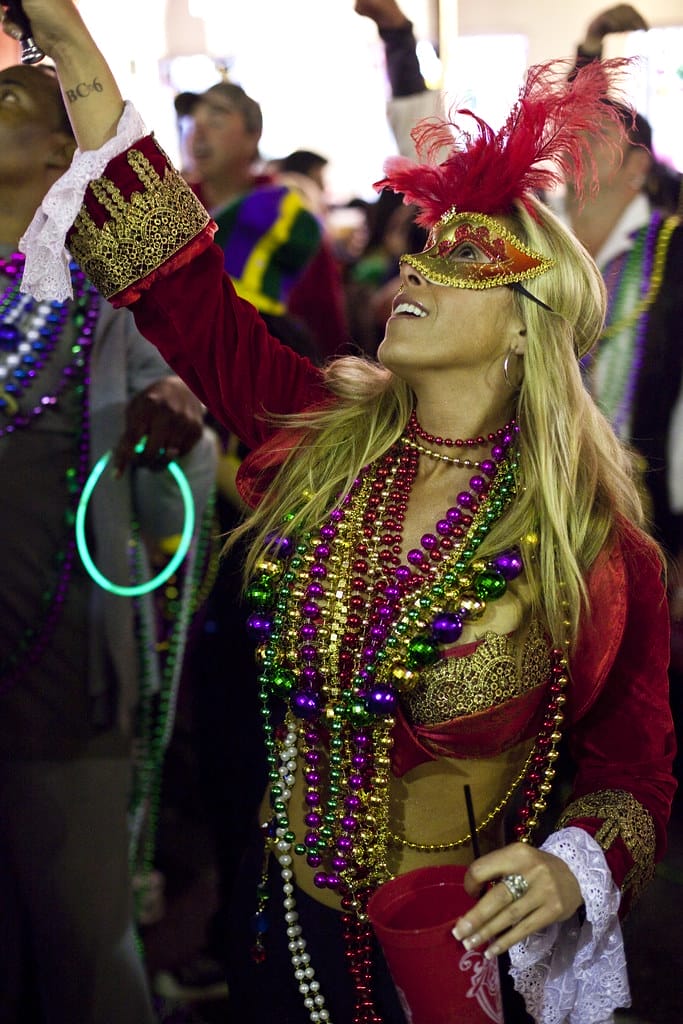 Receiving beads in Mardi Gras in New Orleans