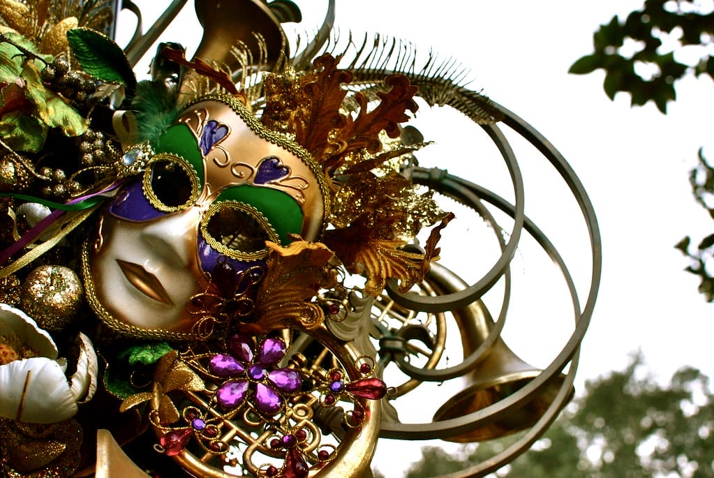 Dressed up with costume and mask for New Orleans Mardi Gras.