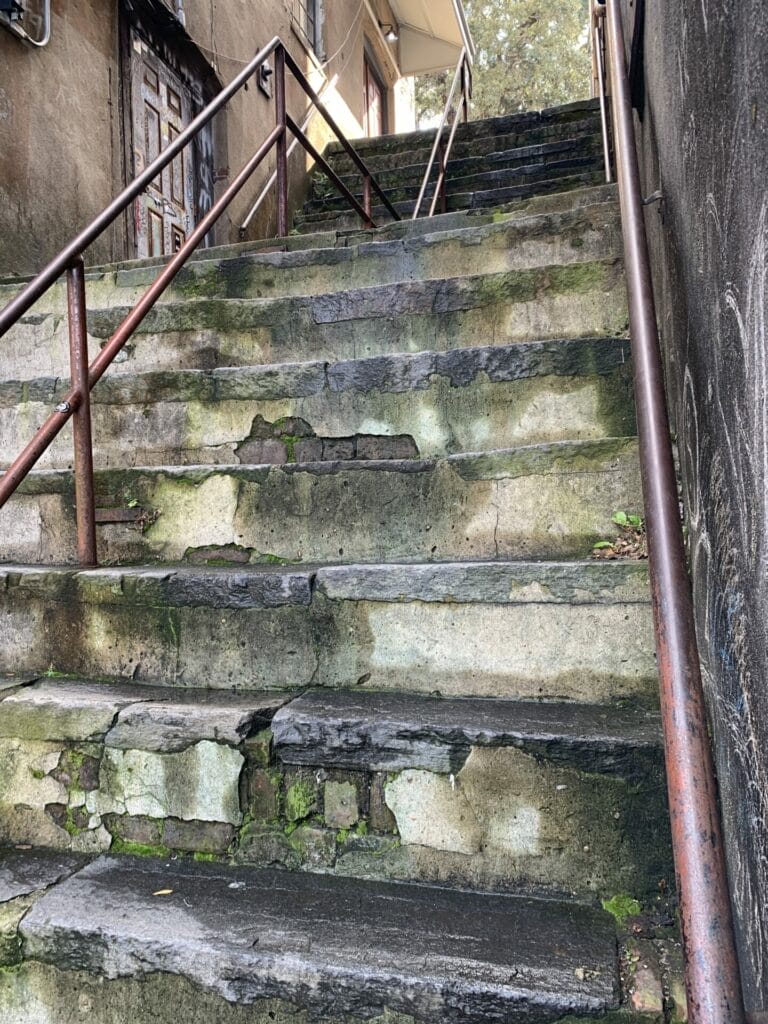 Travel Savannah, Georgia - Historic steps to River Street showing the history behind the steps.