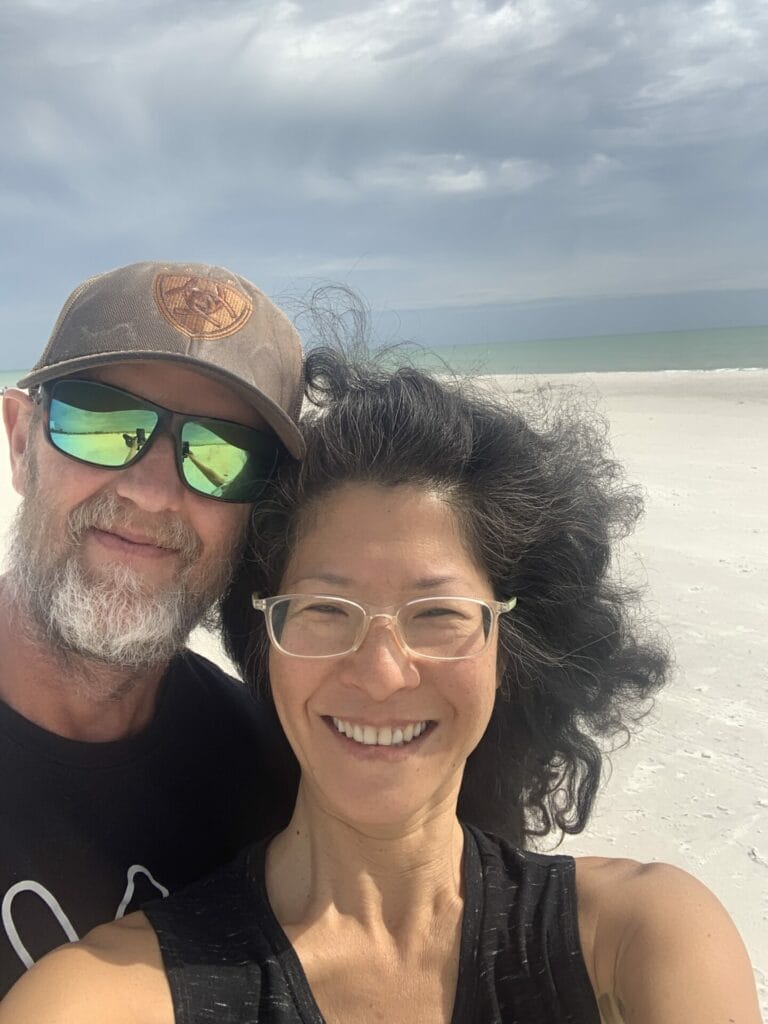 Theron and Lillian enjoying the beautiful sugar white sand beach in Florida.