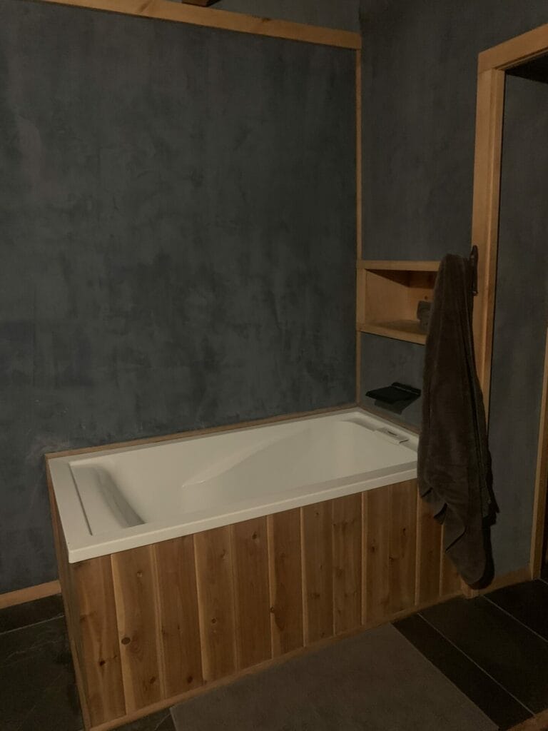 Good size bathtub in the room for dark retreat.