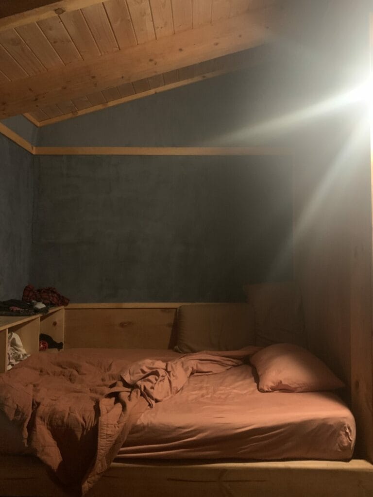 The bed inside the cave of Sky Cave Retreat.