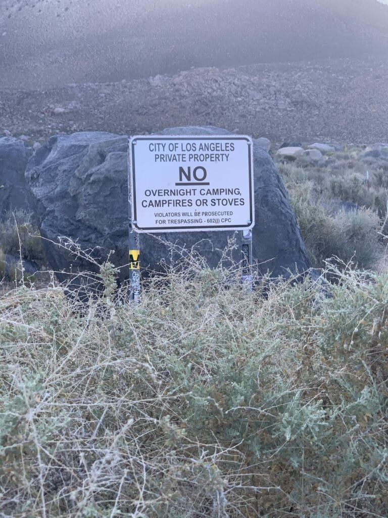 No parking sign in the parking area of Keough Hot Ditch in Southern California, Eastern Sierra area.