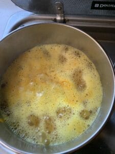 Boiling of the turmeric rice, ready to put lid on.