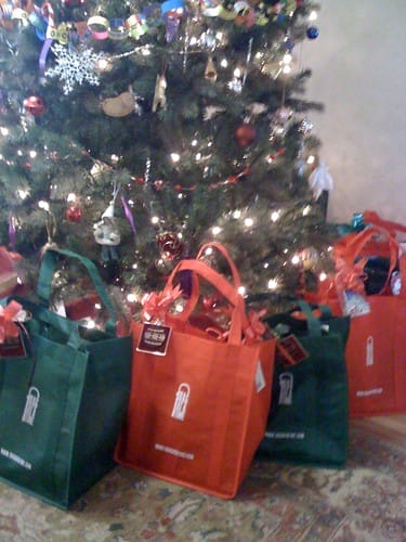 Colorful reusable shopping bags for gifts under the tree to be eco-friendly and more sustainable.