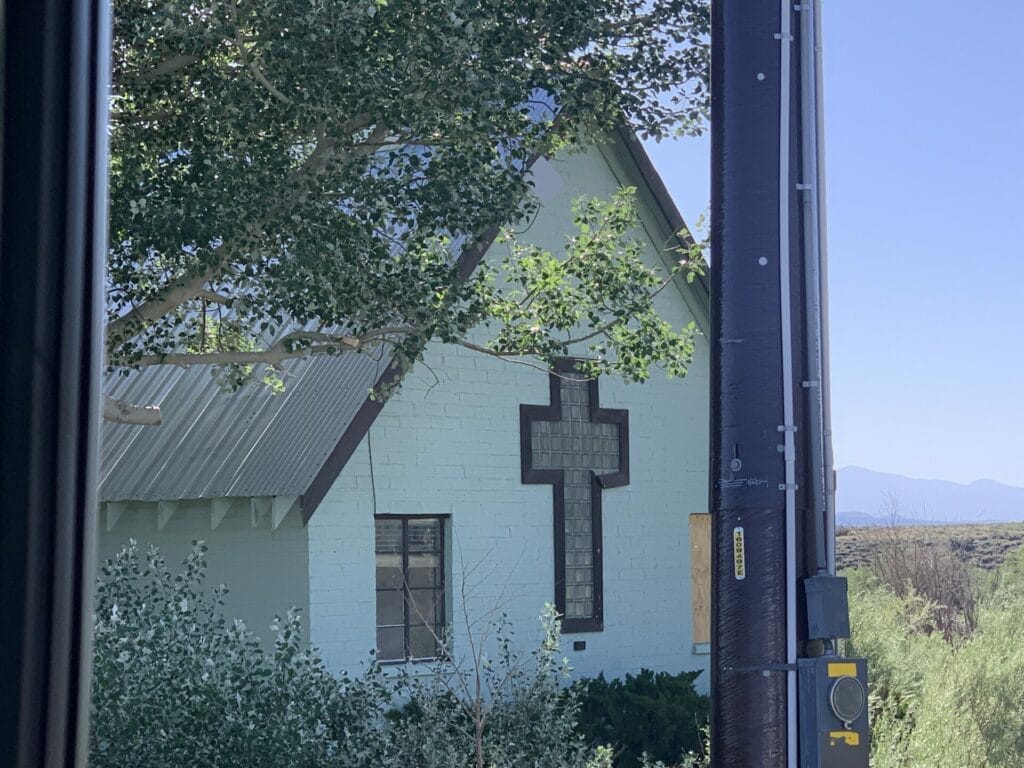 Green little church is the turn to get to Wild Willy's Hot Springs as well as others in the area.