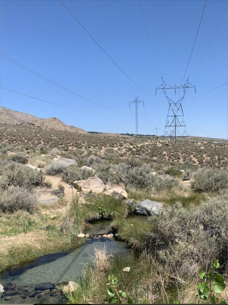 High tension electric wires above the serene hot spring pools at Keough Hot Springs, a striking contrast!