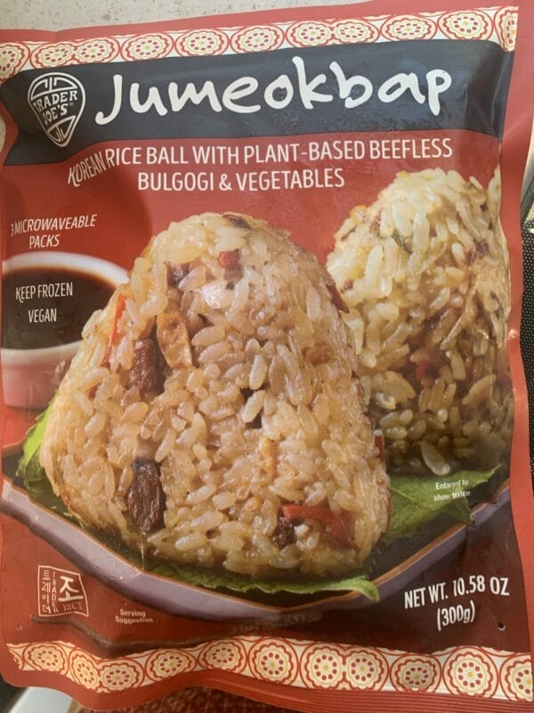 Trader Joe's vegan Jumeokbap has 3 individually packaged rice balls and uses plant-based beef for a vegan delight.