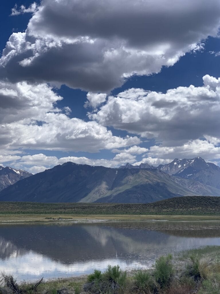 Reflection of the Eastern Sierra mountains onto the late in the afternoon on the way to Wild Willy's Hot Springs by Mammoth Lakes.