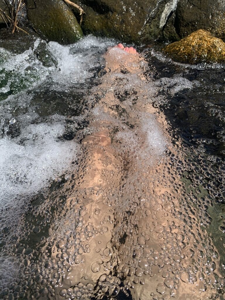 Bubbly hot spring created by the waterfall at Keough Hot Springs Ditch.