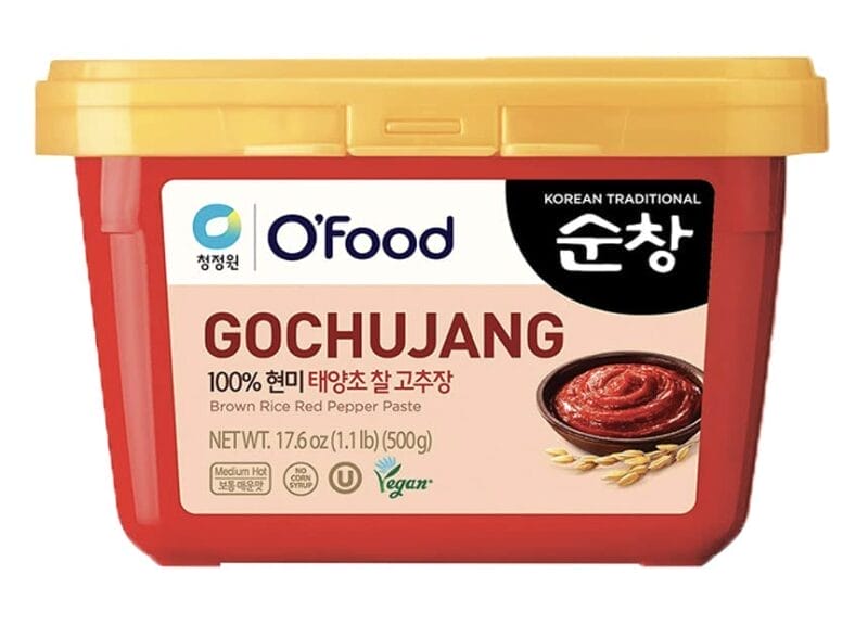 Gochujang is Korean red pepper paste and is in a rectangular tub for easy scooping.