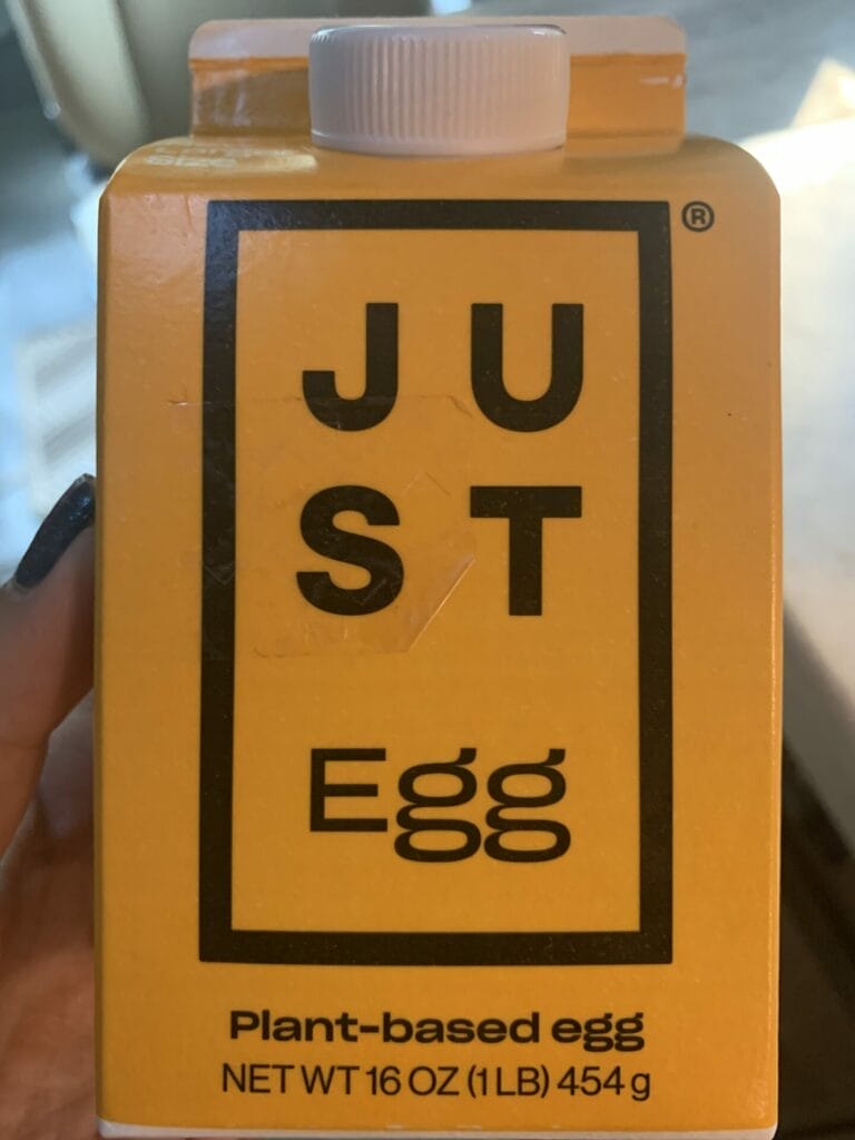 Photo of JUST Egg front packaging carton in yellow with black writing.