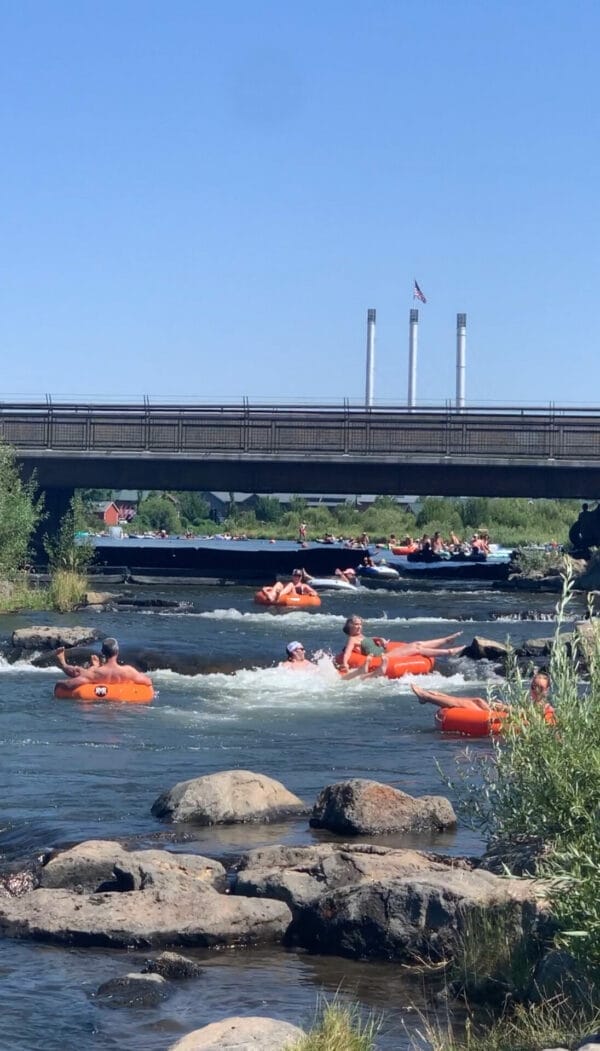 Deschutes River with may people on their tube floating down the river.