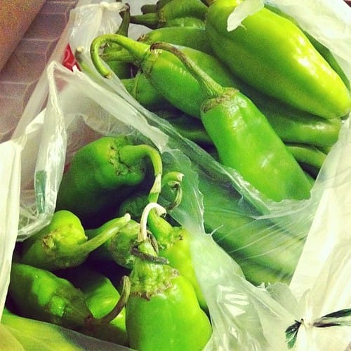 2 boxes of Hatch green chiles with the cases open, showing the deliciousness of New Mexico!