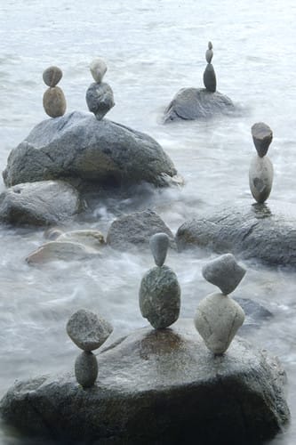 Rocks balanced on bigger rocks in the water...showing tranquility, calm and balanced.