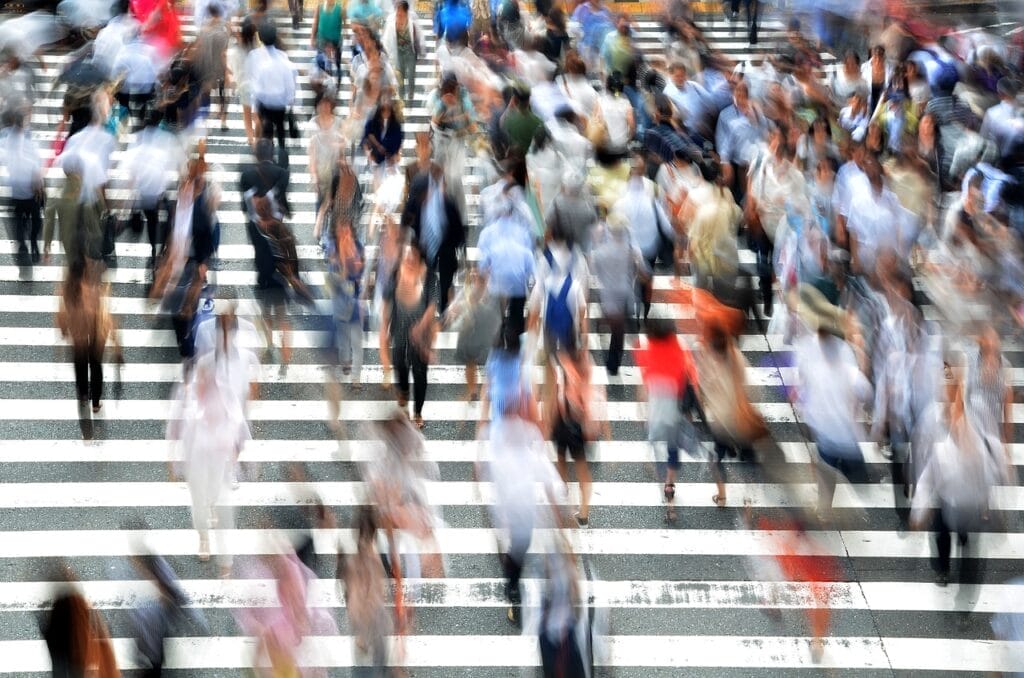 Lot os pedestrians, busy and moving on the road, representing the millions of people's mind is analyzed through Pinterest Trends.