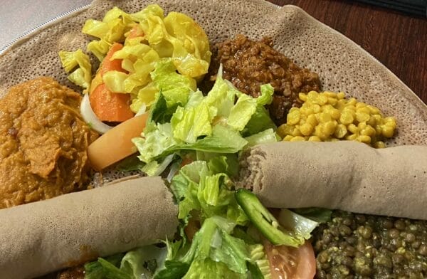 Ethiopian communal platter is to be shared with using injera instead of utensils to pick up food.