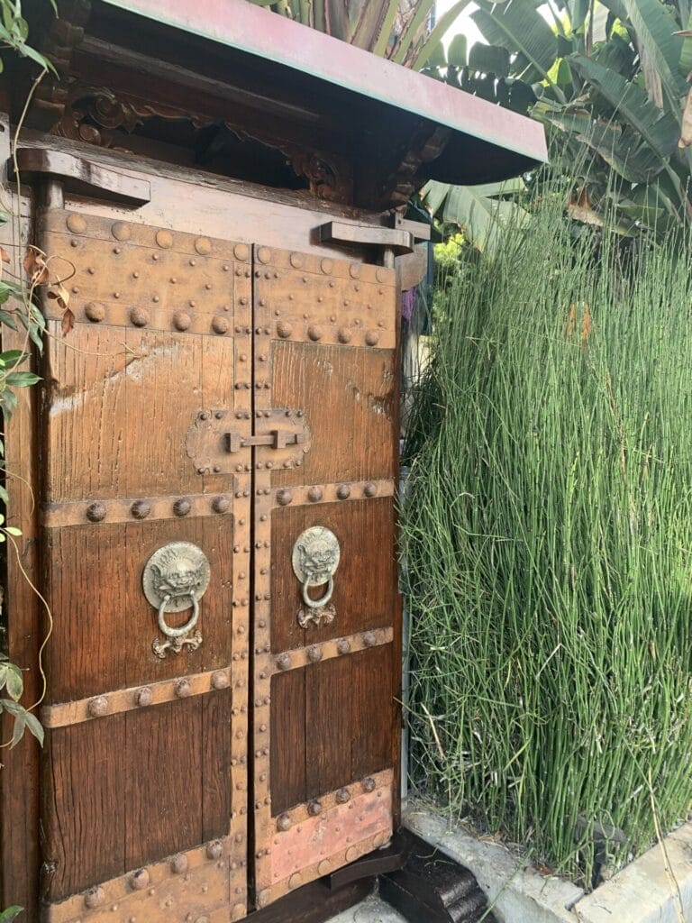 Wooden middle age door with iron accent is one of the beautiful doors at Venice Canals in Los Angeles.