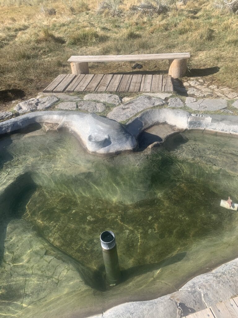 Pool of water with a siphon in it and therefore, the name, Siphon Hot Springs.