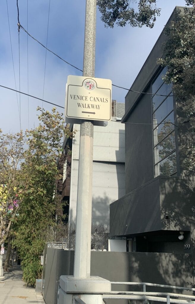 Venice Canals Walkway sign on the road in Venice Beach, California.