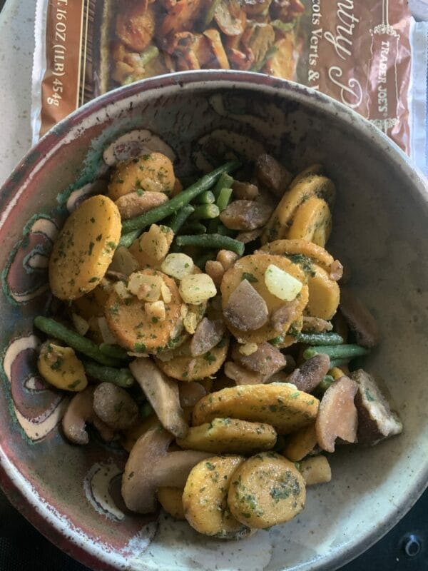 Trader Joe's Country Potatoes with Haricots Verts & Wild Mushrooms in a bowl, ready to be heated, enjoyed, and reviewed.