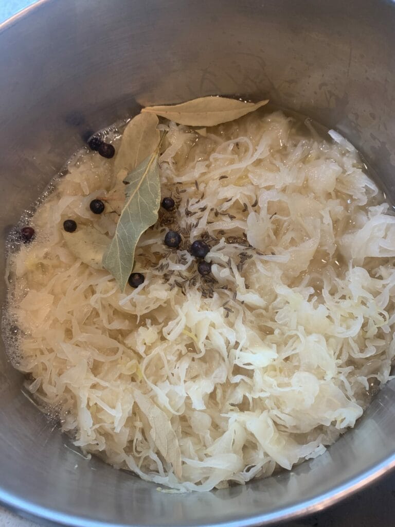 German sauerkraut cooking with apples and spices, the traditional way.