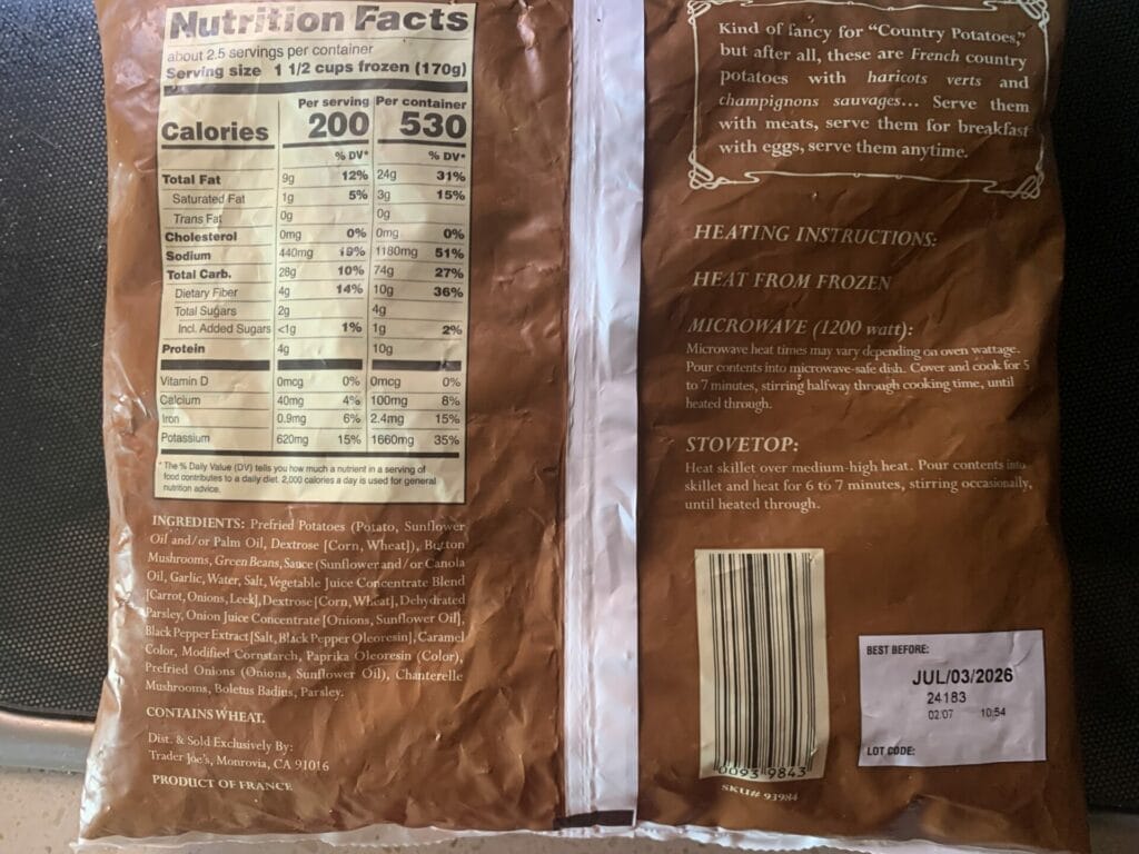 Back lable of Trader Joe's Country Potatoes with haricots Verts & Wild Mushrooms showing nutritional value, ingredients and cooking instructions.