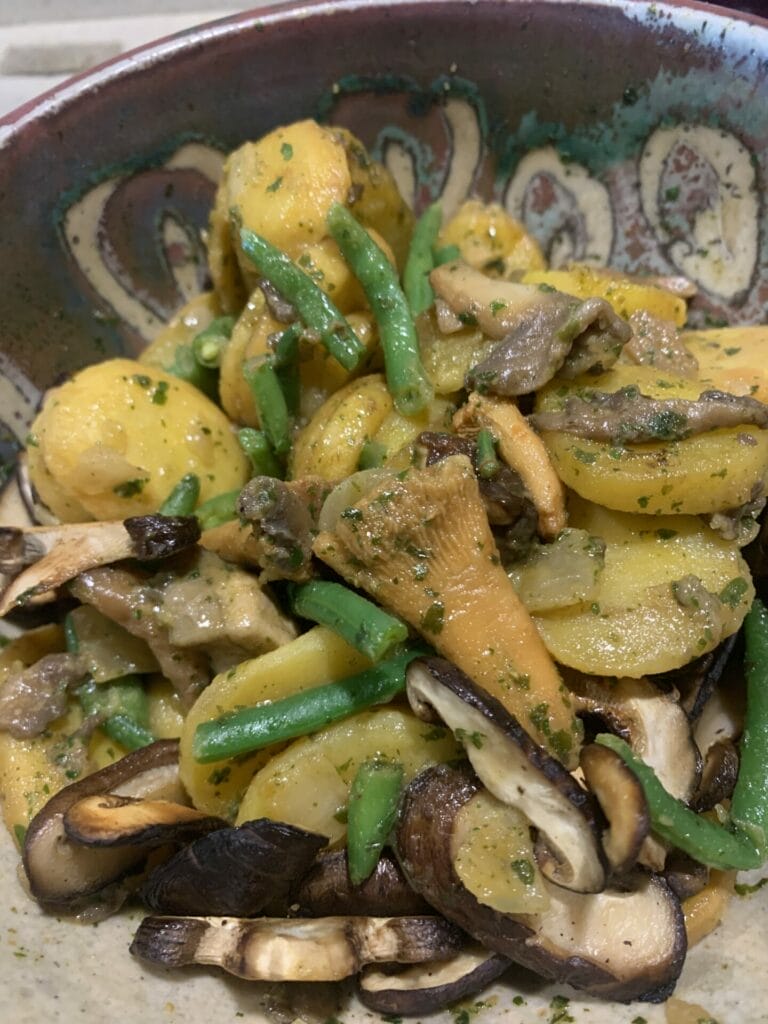 Trader Joe's Country Potatoes with added sliced fresh shiitake mushrooms in a bowl. Delicious and wholesome!