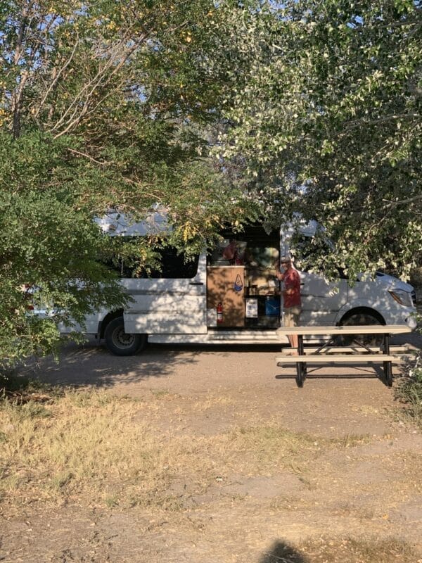 Our van in the shade by the picknic table at the best free camping in Nevada!