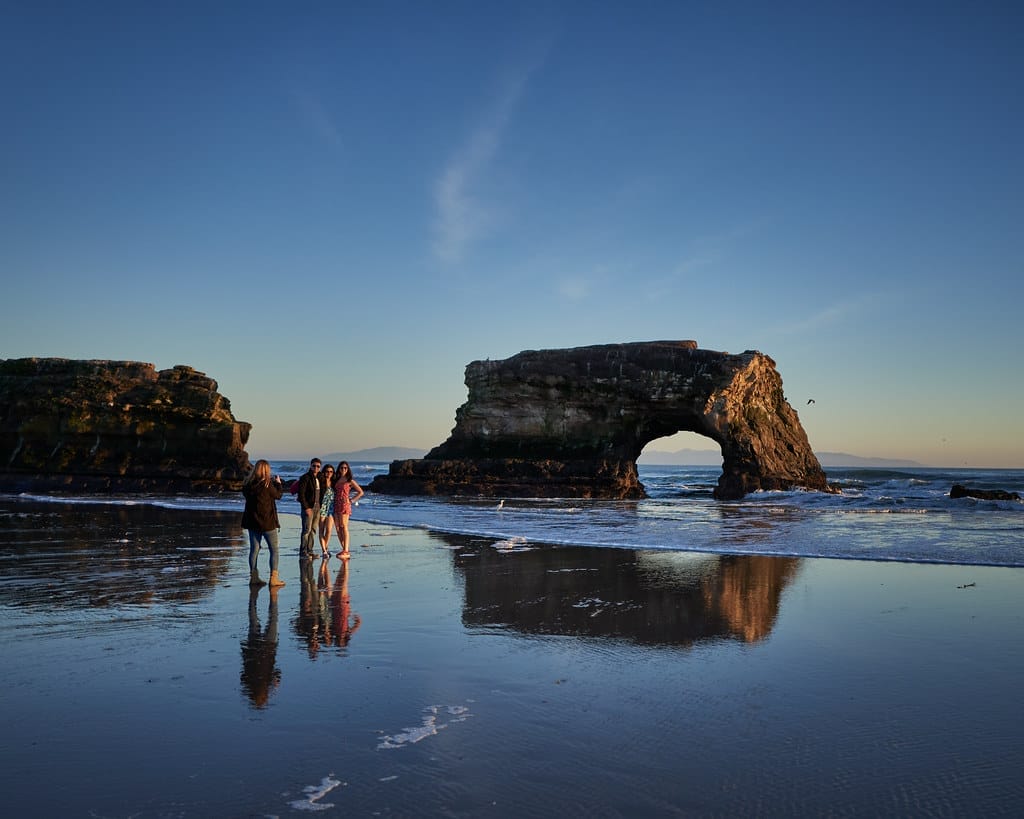 Santa Cruz has so much natural beauty to visit, including ths natural arch bridge on the beach. It's one of the top vegan vanlife destinations in the US.