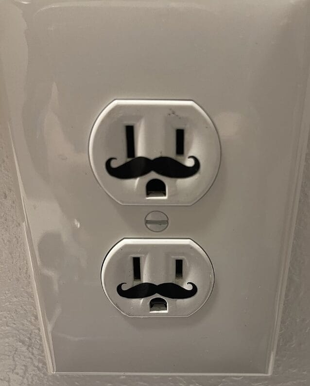 Tiny mustache decal to put on your wall electric outlet to create a face. It is adorable and must have!